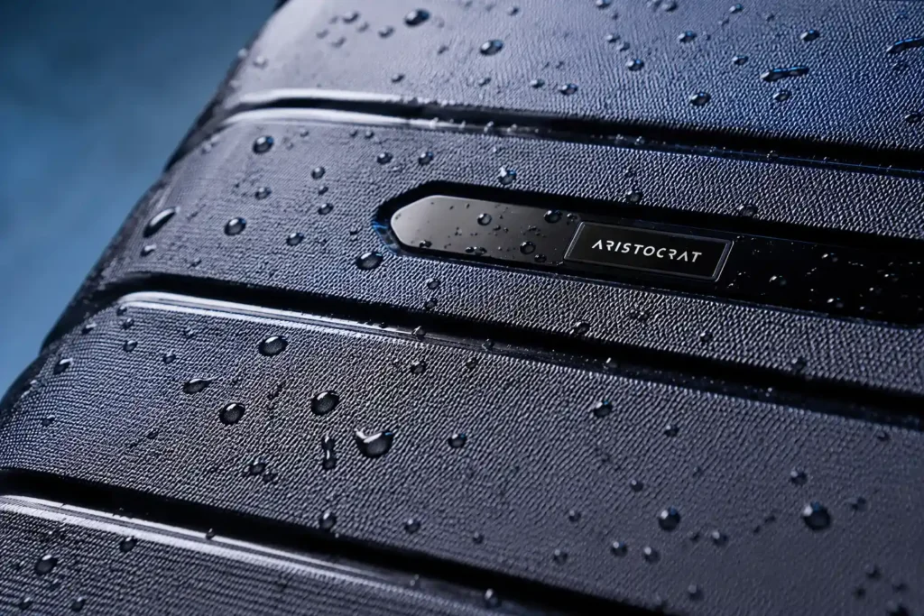 Sleek water droplets on luxurious suitcase Best Aristocrat Liberty Cabin Polypropylene