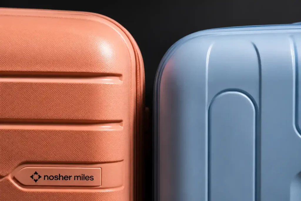 4 Modern hard-shell suitcase close-up Nasher Miles vs American Tourister